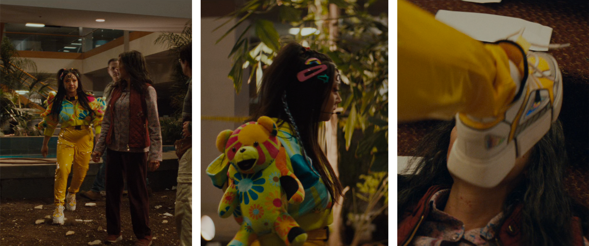EEAAO Screenshot- Raver Jobu, wearing a teddybear hoodie, "Jobu" baby hair, and sickly glitter makeup